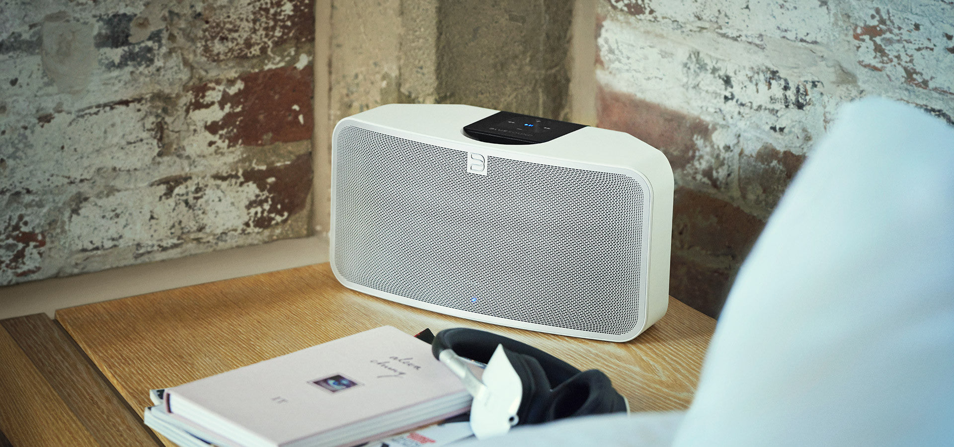 Bluesound - Pulse Mini 2i - Wireless Streaming Speaker (white lifestyle shot) | Douglas HiFi Perth